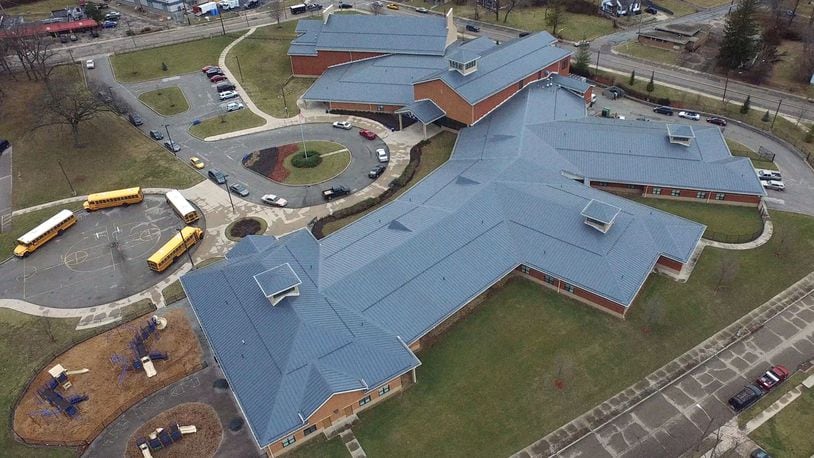 Dayton Public Schools has already resolved some construction problems from last decade’s building boom, such as a $900,000 settlement over defects in the roof construction of Wogaman School. TY GREENLEES / STAFF