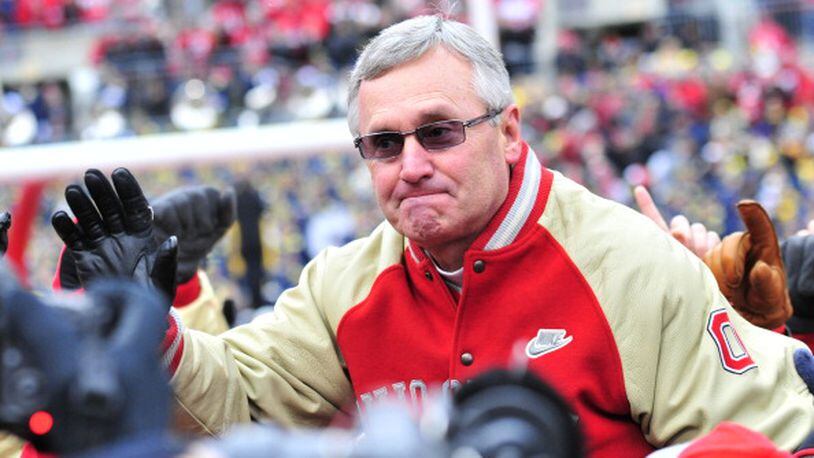 Tressel being hoisted into the air by members of his 2002 National Championship team.