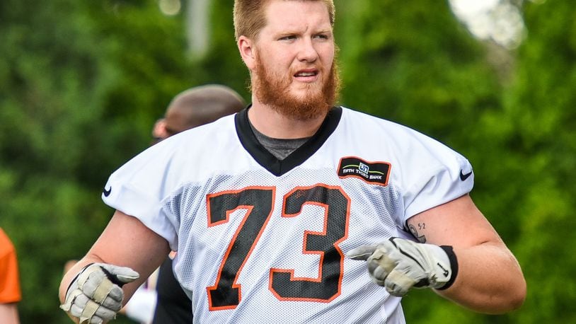 Bengals’ rookie offensive tackle Austin Fleer stretches during organized team activities Tuesday, May 22 at the practice facility near Paul Brown Stadium in Cincinnati. NICK GRAHAM/STAFF