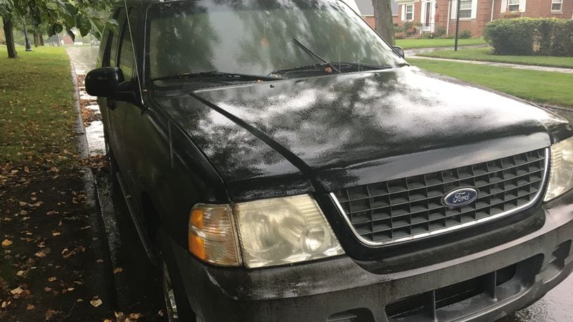 Dayton police last month posted a notice on this 2002 Ford warning that it would be towed if not moved within 48 hours. The vehicle was parked on Benson Drive in the Dayton View Triangle neighborhood in northwest Dayton. CORNELIUS FROLIK / STAFF