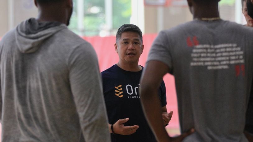 Philip Anloague, of Orion Physical Therapy, talks to players before the first practice for the Red Scare on Monday, July 19, 2021, at the University of Dayton RecPlex. The team plays in The Basketball Tournament starting Saturday in Columbus. David Jablonski/Staff