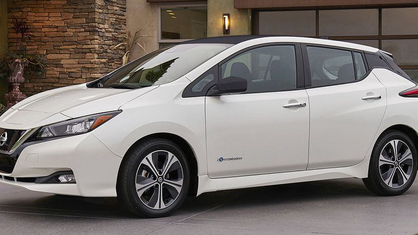 This photo provided by Nissan shows the 2018 Nissan Leaf, a redesigned version of one of the most popular electric vehicles ever produced. It goes on sale in early 2018, with a starting price just under $31,000. (Courtesy of Nissan North America Inc. via AP)