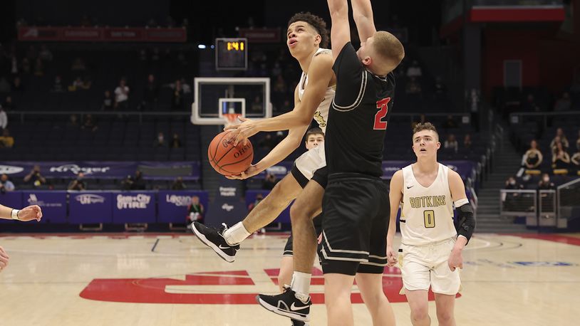 Botkins High School senior Jayden Priddy-Powell drives into Columbus Grove's Blake Reynolds during the Division IV state championship on Sunday morning at UD Arena. Michael Cooper/CONTRIBUTED