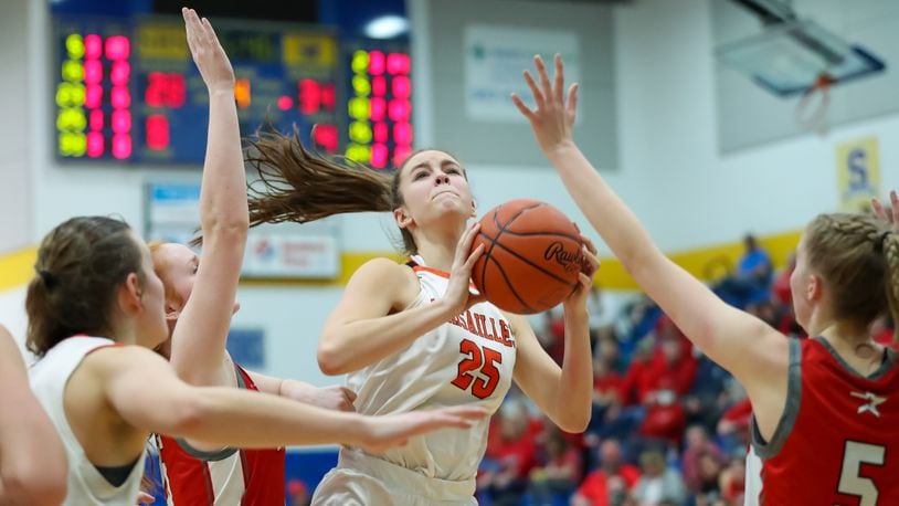 Versailles High School sophomore Taylor Wagner drives to the hoop during their Division III regional semifinal game against East Clinton on Wednesday, March 1 at Springfield High School. The Tigers won 45-41. Michael Cooper/CONTRIBUTED