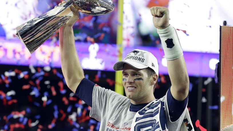 Quarterback Tom Brady celebrates with his fourth Vince Lombardi Trophy after the Patriots defeated the Seahawks 28-24 in the NFL Super Bowl XLIX football in Glendale, Arizona. Being lucky enough to avoid being picked by the Browns truly has been a blessing for the University of Michigan product. AP photo