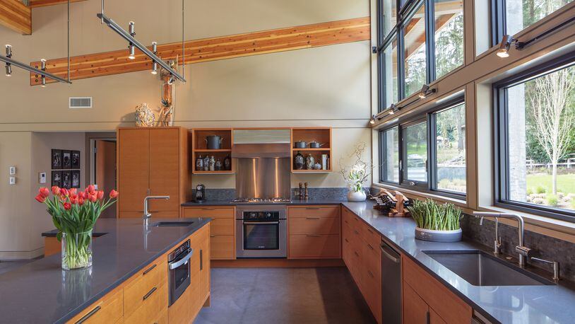 “Everything is on view” in the kitchen, with stone-look, stain-resistant Caesarstone countertops; a tile backsplash; and custom-crafted cabinetry from Douglas fir plywood, says architect Stephen Bobbitt. “We were mindful of what went where.” (Steve Ringman/Seattle Times/TNS)