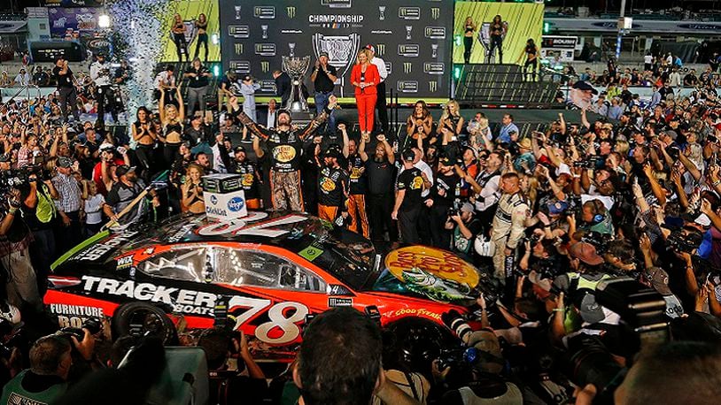 Martin Truex Jr., celebrates as he wins the Monster Energy NASCAR Cup Series Championship and EcoBoost 400 on Sunday, Nov. 19, 2017 at the Homestead-Miami Speedway in Homestead, Fla. (Carl Juste/Miami Herald/TNS)