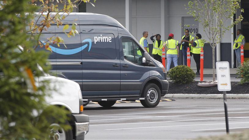 Amazon is ramping up its operation in the Kettering Business Park. Delivery vans have been filling the parking lots of the distribution center for about three weeks. TY GREENLEES / STAFF