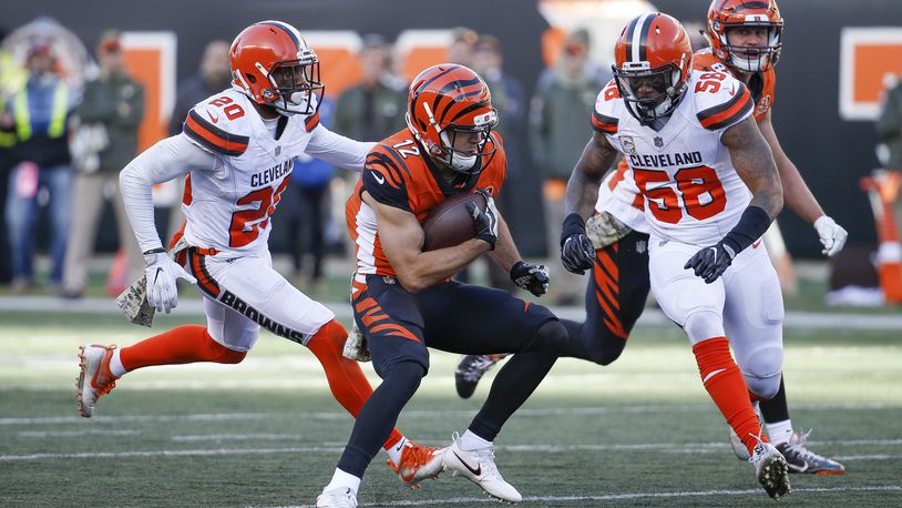 Cincinnati Bengals wide receiver Alex Erickson (12) runs the ball against Cleveland Browns outside linebacker Christian Kirksey (58) in the second half of an NFL football game, Sunday, Nov. 26, 2017, in Cincinnati. (AP Photo/Frank Victores)