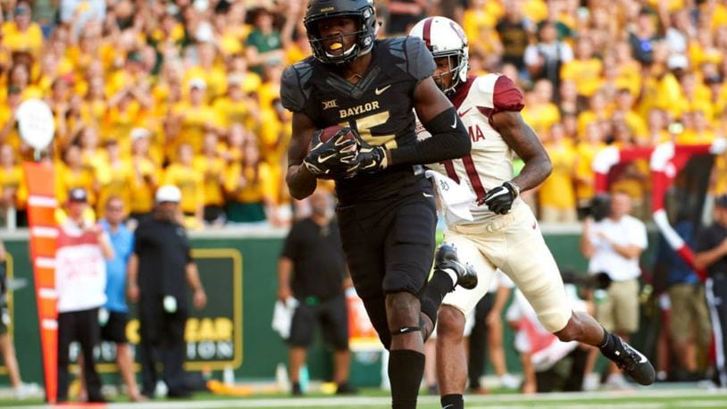 Baylor wide receiver Denzel Mims scored big with a Waco man and his son when he invited them to bowl with the Bears.
