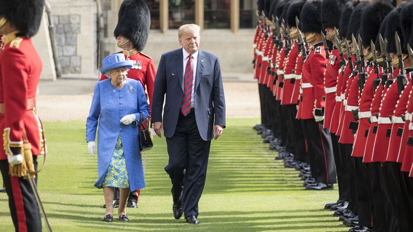 U.S. President Donald Trump and Britain's Queen Elizabeth II inspect a Guard of Honour, formed of the Coldstream Guards at Windsor Castle on July 13, 2018 in Windsor, England. Royal watchers said Trump briefly walked in front of the Queen, which some consider a breach in royal protocol.