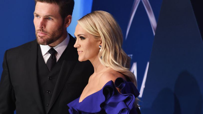 NASHVILLE, TN - NOVEMBER 08: (FOR EDITORIAL USE ONLY)  NHL player Mike Fisher and singer-songwriter Carrie Underwood attend the 51st annual CMA Awards at the Bridgestone Arena on November 8, 2017 in Nashville, Tennessee.  (Photo by Michael Loccisano/Getty Images)