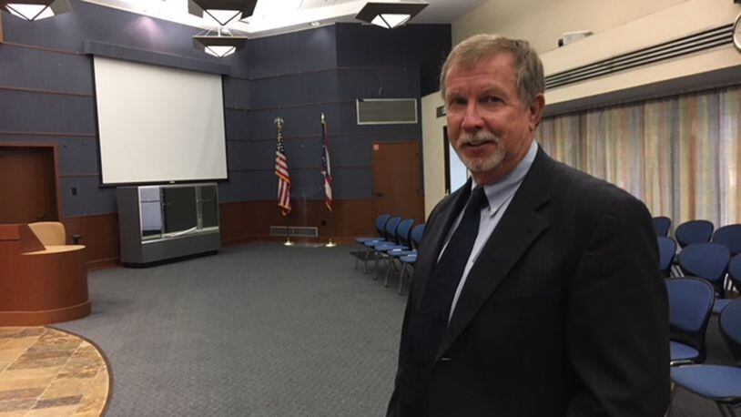 Dave Hicks in his natural element, at Moraine city hall council chambers. THOMAS GNAU/STAFF