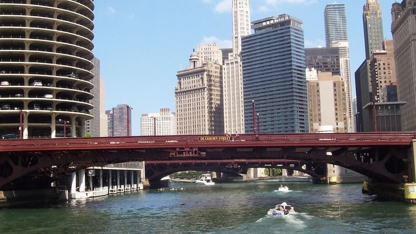 You get a bottom-up view of the Chicago skyline-with streets, sidewalks and pedestrians all above the cruise boats on the low-lying Chicago River in Chicago. (Bob Downing/Akron Beacon Journal/TNS)