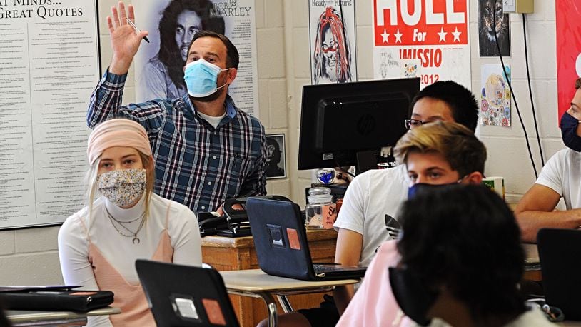 A Beavercreek High School teacher works with students on Oct. 8, 2020. Beavercreek schools moved to a hybrid online/in-person system Oct. 19, after Greene County was moved to the "red" level in the state health alert system.