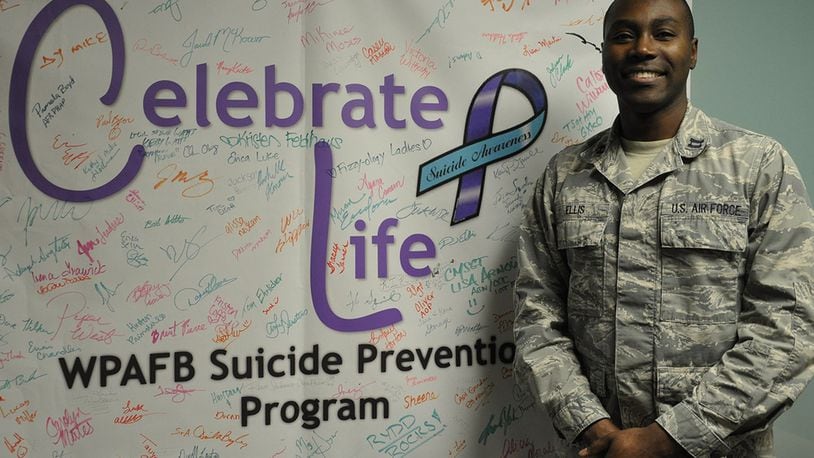 Capt. Gary Ellis, Wright-Patterson Air Force Base Suicide Prevention Program manager, stands in front of the Celebrate Life poster in the Wright-Patterson Medical Center Mental Health Clinic. The Suicide Prevention Program is an element of the Individual Delivery System, or IDS, which is a collaboration of base helping agencies that provide care to Airmen and their families. (U.S. Air Force photo/Staff Sgt. Whitney Trimble)