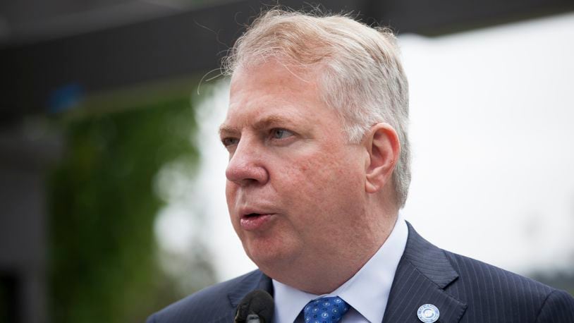 Seattle Mayor Ed Murray holds a press conference after signing a bill that raises the city's minimum wage to $15 an hour on June 3, 2014 in Seattle, Washington. (Photo by David Ryder/Getty Images)