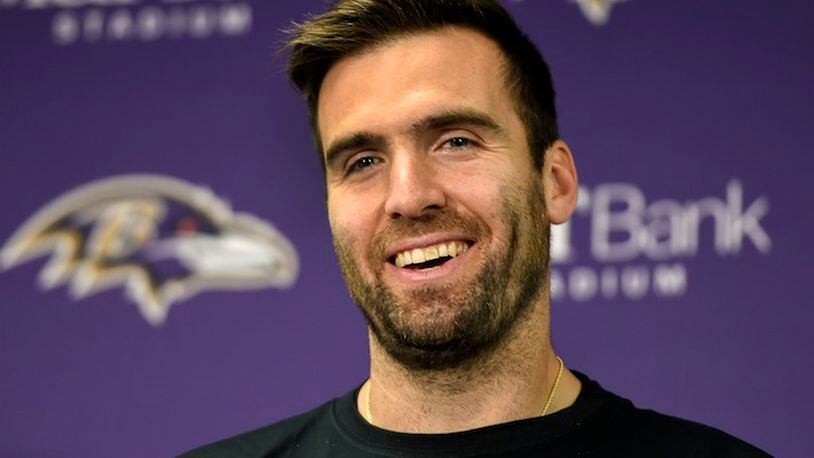 Baltimore Ravens quarterback Joe Flacco (5) smiles as he answers a question during a post game press conference after an NFL football game against the Cincinnati Bengals in Baltimore, Sunday, Nov. 27, 2016. The Baltimore Ravens defeated the Cincinnati Bengals 19-14. (AP Photo/Gail Burton)