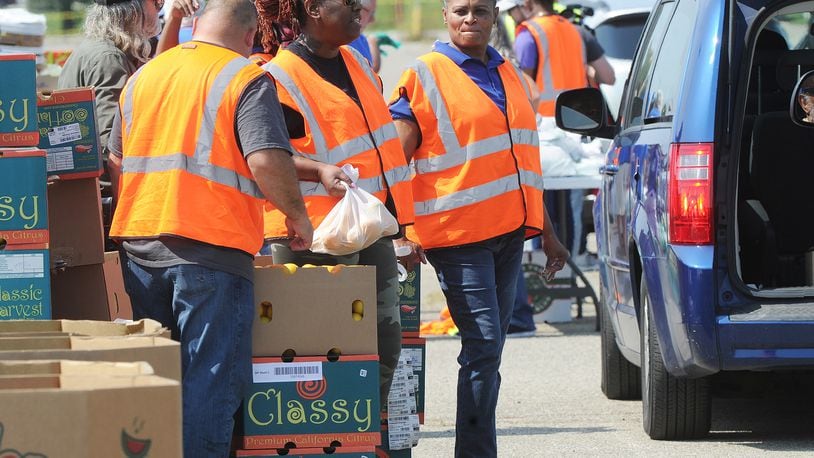 The Foodbank Inc. held a drive-thru food distribution at the old Salem Mall in Trotwood Thursday Sept. 15, 2022. Guests received fresh produce, proteins, grains and other products free of charge. MARSHALL GORBY\STAFF







MARSHALL GORBY\STAFF