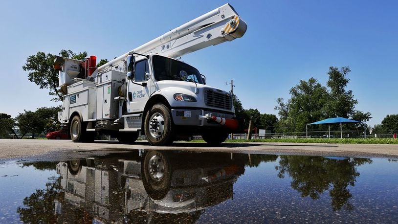 A Duke Energy crew responded to Smith Park to repair downed power lines. Many were without power in Middletown Tuesday, June 14, 2022 after a storm knocked down trees and limbs creating power outages. NICK GRAHAM/STAFF