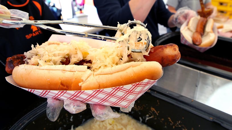 A giant hot dog is topped with sauerkraut at a past Ohio Sauerkraut Festival.