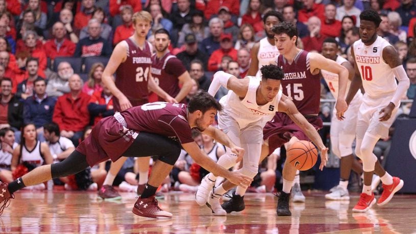 Dayton’s Darrell Davis comes up with a loose ball against Fordham on Saturday, Feb. 17, 2018, at UD Arena. David Jablonski/Staff