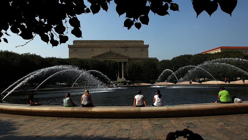 People sit around the fountains at the National Gallery of Art Sculpture Garden. (Photo: Win McNamee/Getty Images)