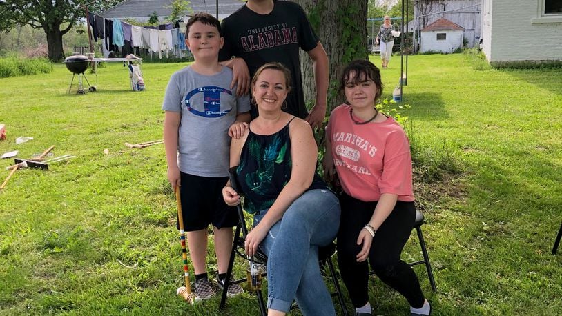 Sarah Greathouse with her children, Harrison, McKelvey and Gus.