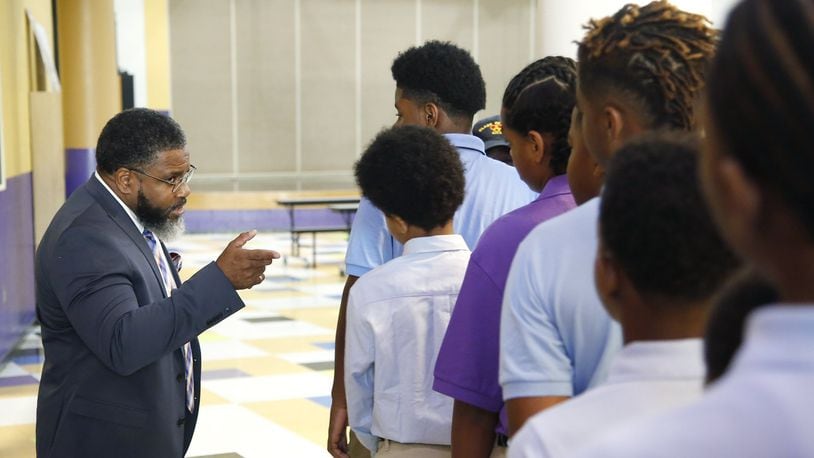 On the first day of class in 2018, Dayton Boys Prep Academy Principal Therman Sampson II talks to students about school procedures. TY GREENLEES / STAFF