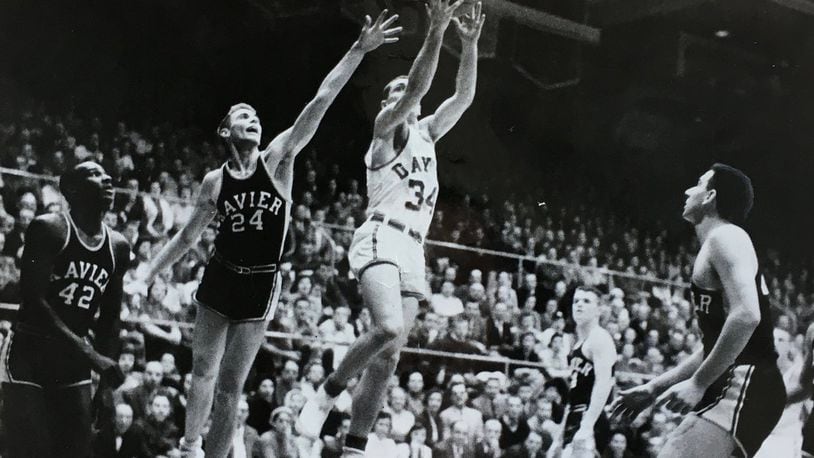 Dayton guard Frank Case goes up for a layup during his career in the 1950s. Photo courtesy of Case