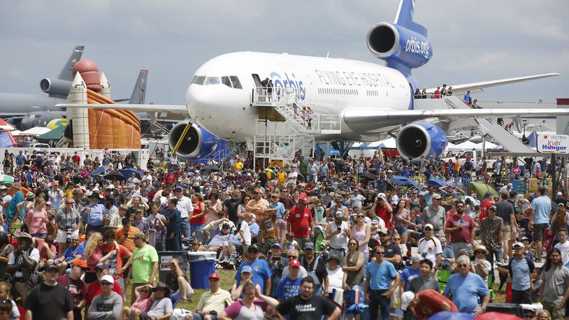 A thick crowd watches the performers on Saturday at the Vectren Dayton Air Show.   TY GREENLEES / STAFF