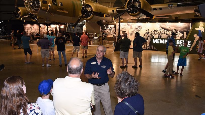 Don Meyer, a National Museum of the U.S. Air Force tour guide, tells a group of museum guests about the Memphis Belle exhibit. (U.S. Air Force photo)
