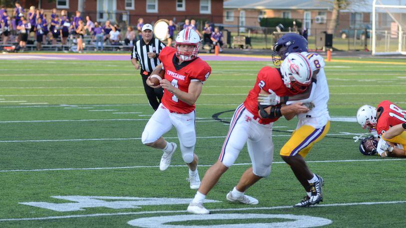 Tipp's Liam Poronsky looks for room to run in Friday night's season-opening game vs. Bellbrook. Eric Frantz/CONTRIBUTED