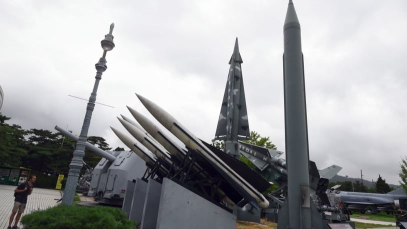 A man looks at replicas of a North Korean Scud-B missile (R) and South Korean missiles at the Korean War Memorial in Seoul on Thursday.