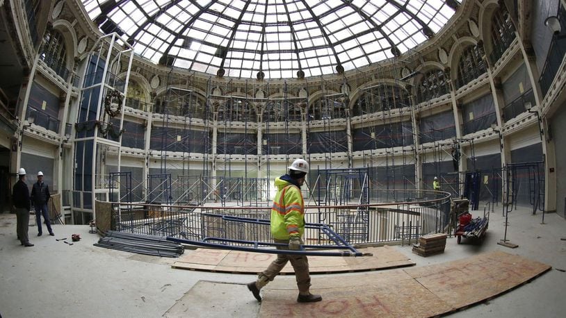 Scaffolding is being installed to complete lead paint removal inside the Dayton Arcade rotunda area. The escalator has been removed and is elevator is to be removed soon according to developers. TY GREENLEES / STAFF