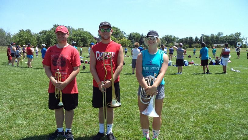 Sam Brewster, a senior; Brice Hall, a junior, and Darcy Brodehl, a sophomore, play in the brass section for Miamisburg High School Marching Band. CONTRIBUTED