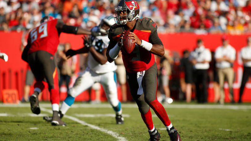 Quarterback Jameis Winston of the Buccaneers looks for an open receiver during a Jan. 1 game against the Panthers in Raymond James Stadium in Tampa.
