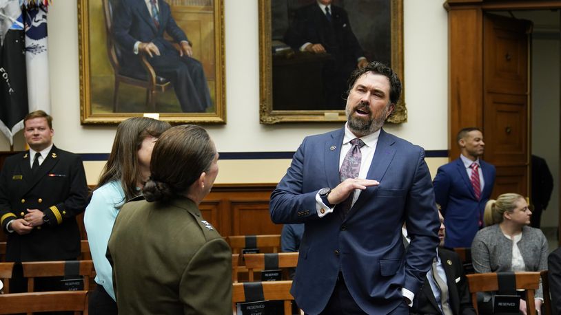 Rep. Morgan Luttrell, R-Texas, talks before the start of the House Armed Services Committee hearing on the Department of the Navy's budget request for fiscal year 2024, on Capitol Hill in Washington, Friday, April 28, 2023. (AP Photo/Carolyn Kaster)