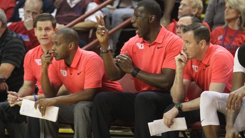 Dayton coaches (left to right) Darren Hertz, Anthony Solomon, Anthony Grant and Darren Hertz watch the action during a game against Old Dominion on Sunday, Nov. 19, 2017, at TD Arena in Charleston, S.C. David Jablonski/Staff