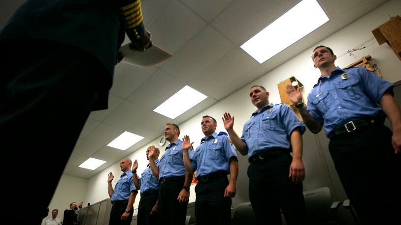 Graduates are sworn in by Fire Chief Herbert Redden at Dayton Fire Department’s Paramedic Graduation ceremony at the Fire Training Center, 200 McFadden Avenue, on Friday, June 17th, 2011. Staff Photo by Jim Witmer