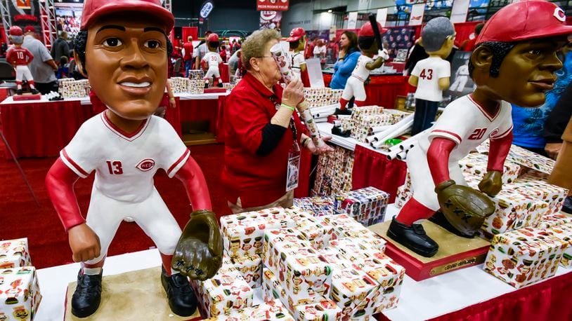 The bobblehead booth was decorated with oversized bobbleheads of former Reds players during RedsFest in December 2016 at Duke Energy Convention Center in Cincinnati. Pictured here are bobbleheads of Dave Concepcion, left, and Cesar Geronimo. NICK GRAHAM/STAFF