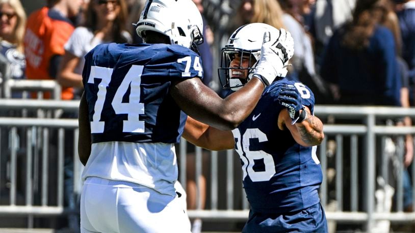 Penn State tight end Brenton Strange (86) celebrates with offensive lineman Olumuyiwa Fashanu (74) after scoring a touchdown during the first half of an NCAA college football game, Saturday, Sept. 24, 2022, in State College, Pa. (AP Photo/Barry Reeger)