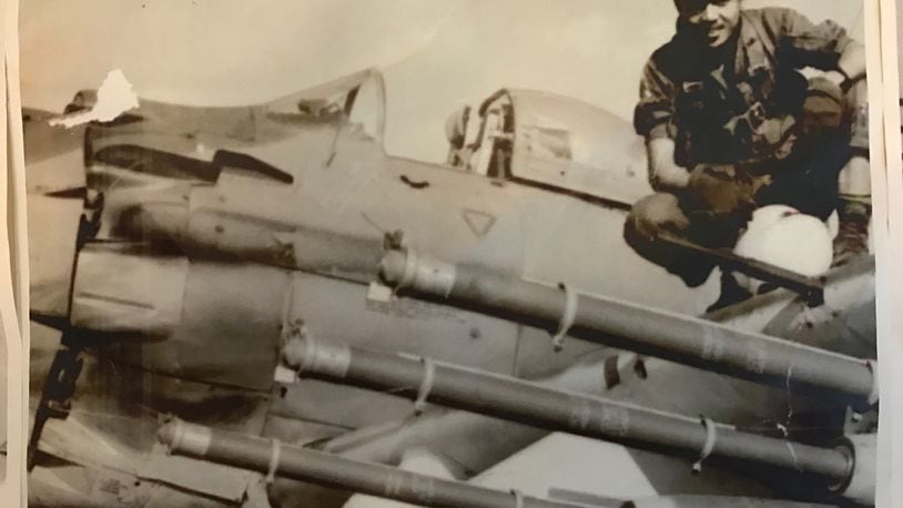 Pilot Ba Nguyen on the wing of his A-1 Skyraider that’s loaded with long fuse Mk 82 missiles. Based at Bien Hoa Air Base, he flew some 1,500 combat missions for the Republic of Vietnam Air Force (RVNAF).     (Contributed Photo)