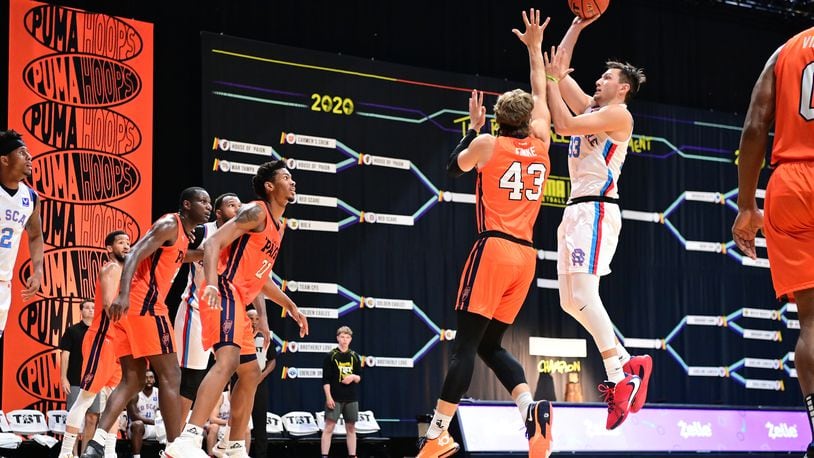 Ryan Mikesell os Red Scare puts up a shot vs. House of 'Paign in last year's TBT.  Ben Solomon/CONTRIBUTED