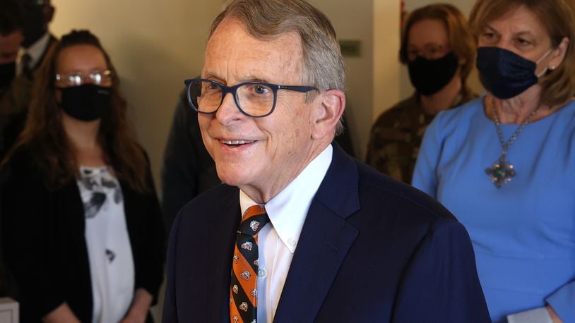 Governor Mike DeWine speaks to members of the media as he tours the vaccination clinic at New Carlisle Senior Living. BILL LACKEY/STAFF