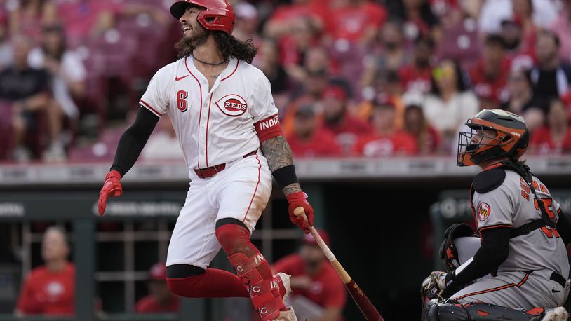 Cincinnati Reds' Jonathan India (6) reacts as he flies out for the third out in the ninth inning of a baseball game against the Baltimore Orioles, Sunday, May 5, 2024, in Cincinnati. Orioles catcher Adley Rutschman, right, looks on. (AP Photo/Carolyn Kaster)