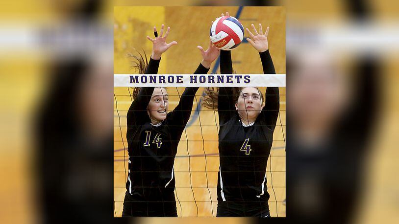 Bellbrook’s Kira Merkle and Mara Neal team up to block a volley during their volleyball match at Monroe Thursday, Sept. 15, 2016. FILE PHOTO