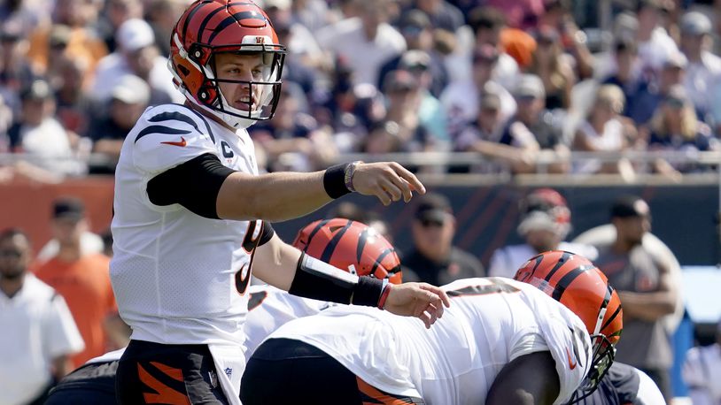 Cincinnati Bengals quarterback Joe Burrow calls a play at the line of scrimmage during the first half of an NFL football game against the Chicago Bears Sunday, Sept. 19, 2021, in Chicago. (AP Photo/Nam Y. Huh)