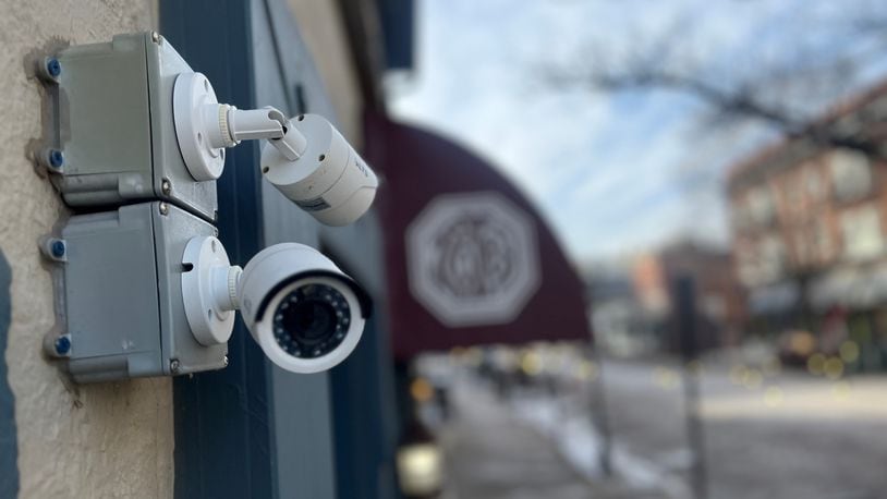 Security cameras outside of a restaurant in the Oregon District in Dayton. CORNELIUS FROLIK / STAFF