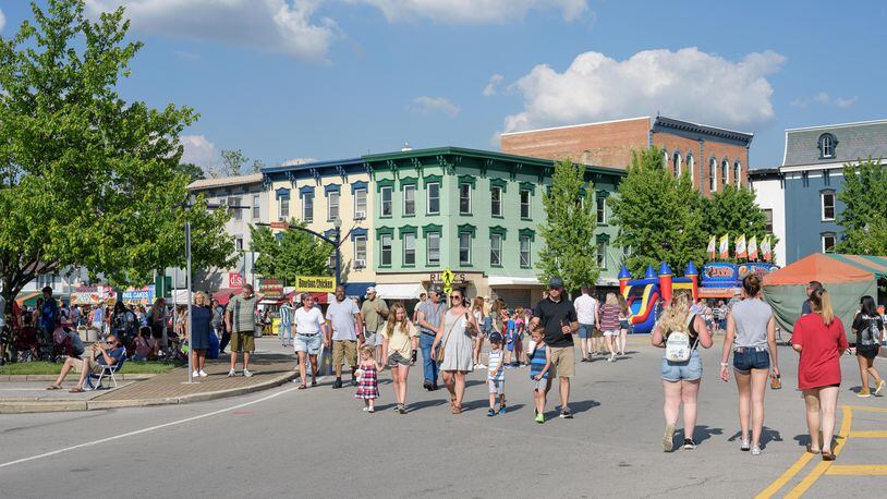 People walk through downtown Troy's business area during the Strawberry Jam in June 2021. TOM GILLIAM / CONTRIBUTING PHOTOGRAPHER